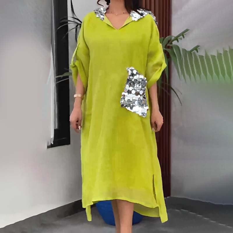 Maxi abito con cappuccio in paillettes a squame di pesce