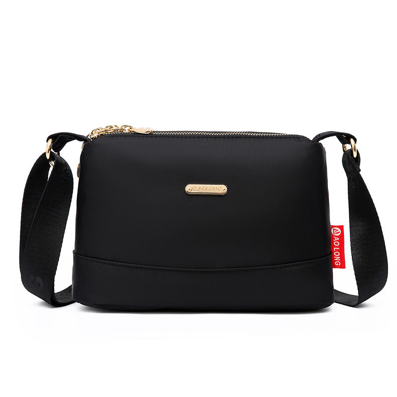 Borsa a tracolla in tela impermeabile