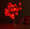Albero luminoso da tavolo con fiori di rosa