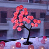 Albero luminoso da tavolo con fiori di rosa